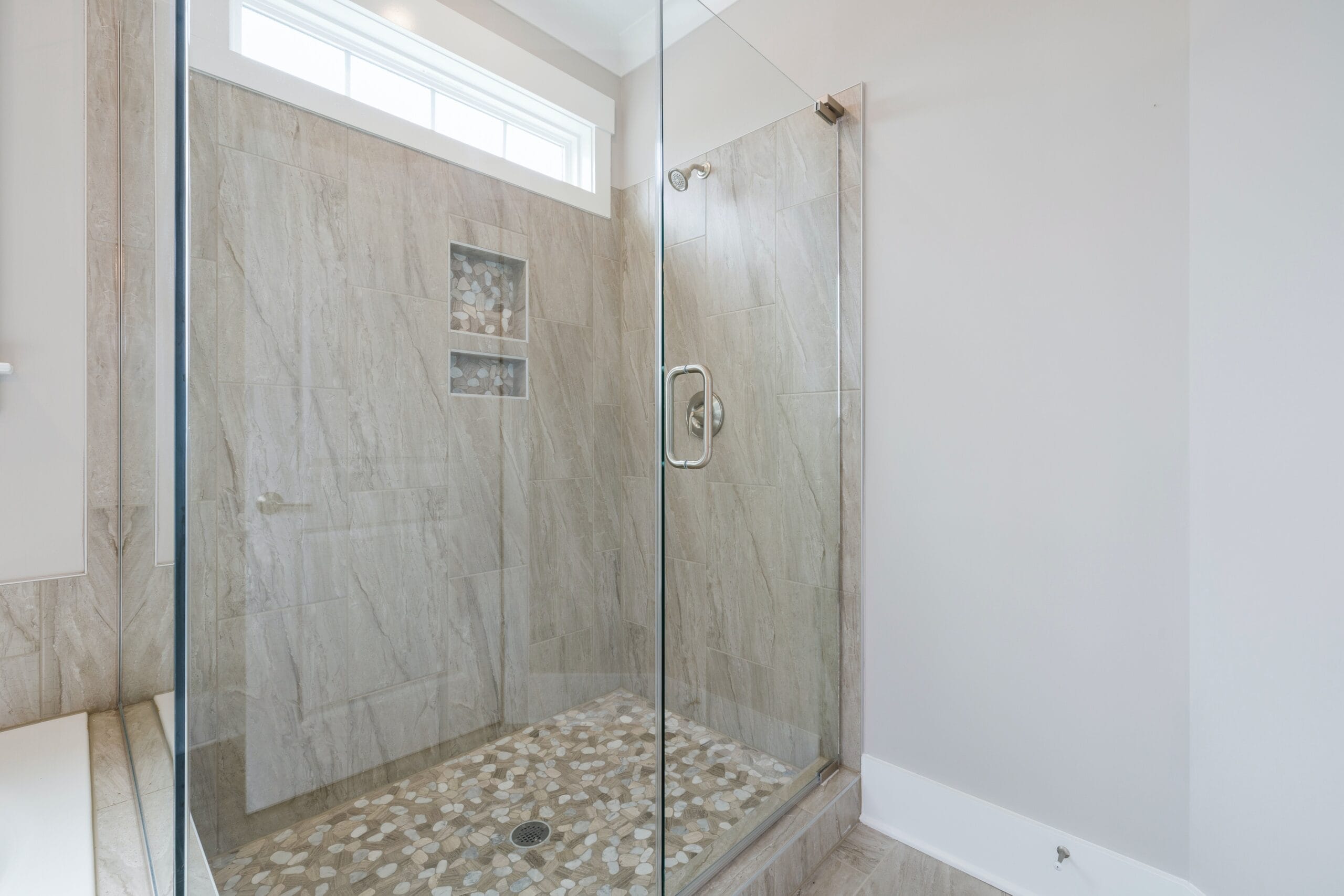 a bathroom with a glass door and white tiles, in the style of water drops,