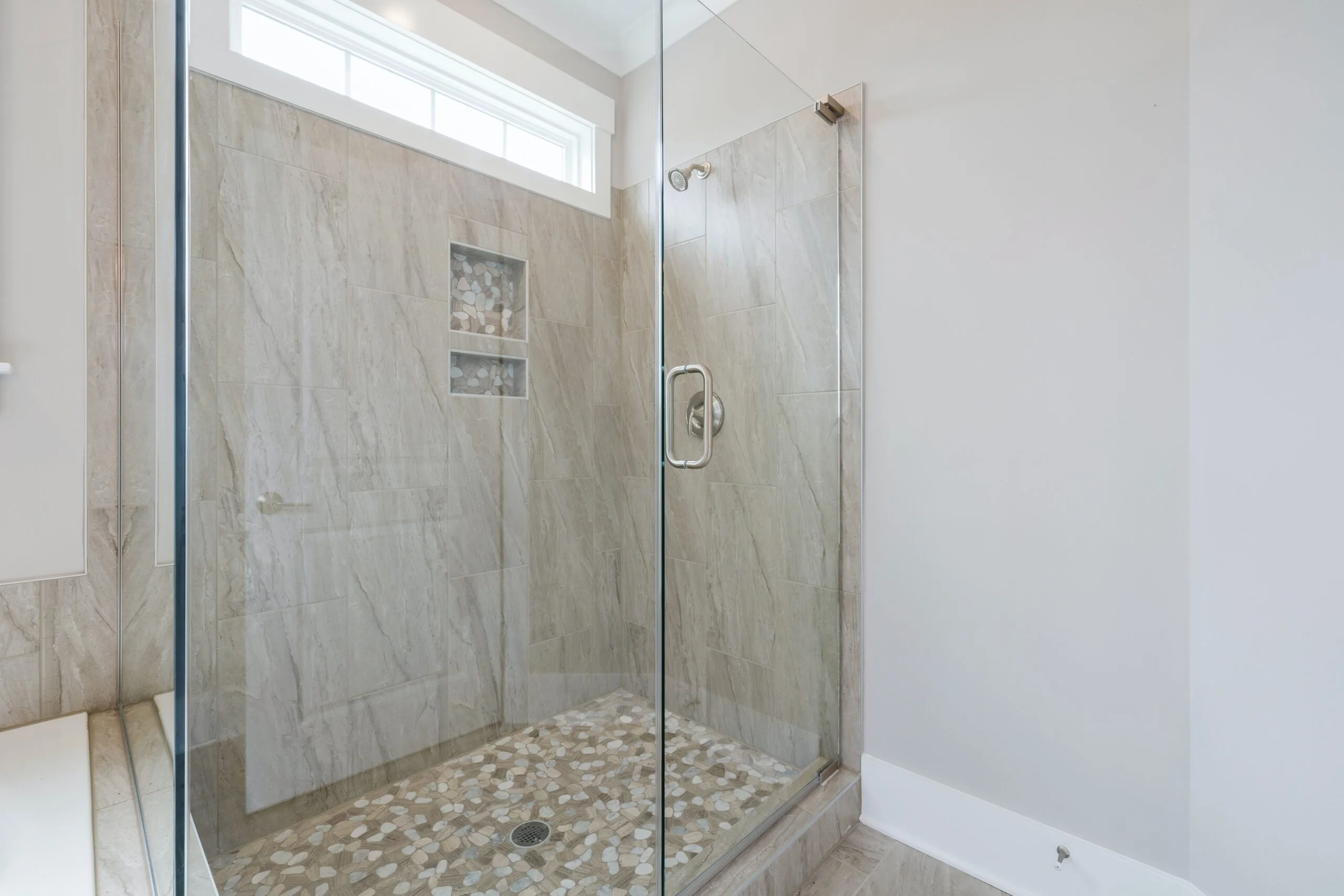 a bathroom with a glass door and white tiles, in the style of water drops,