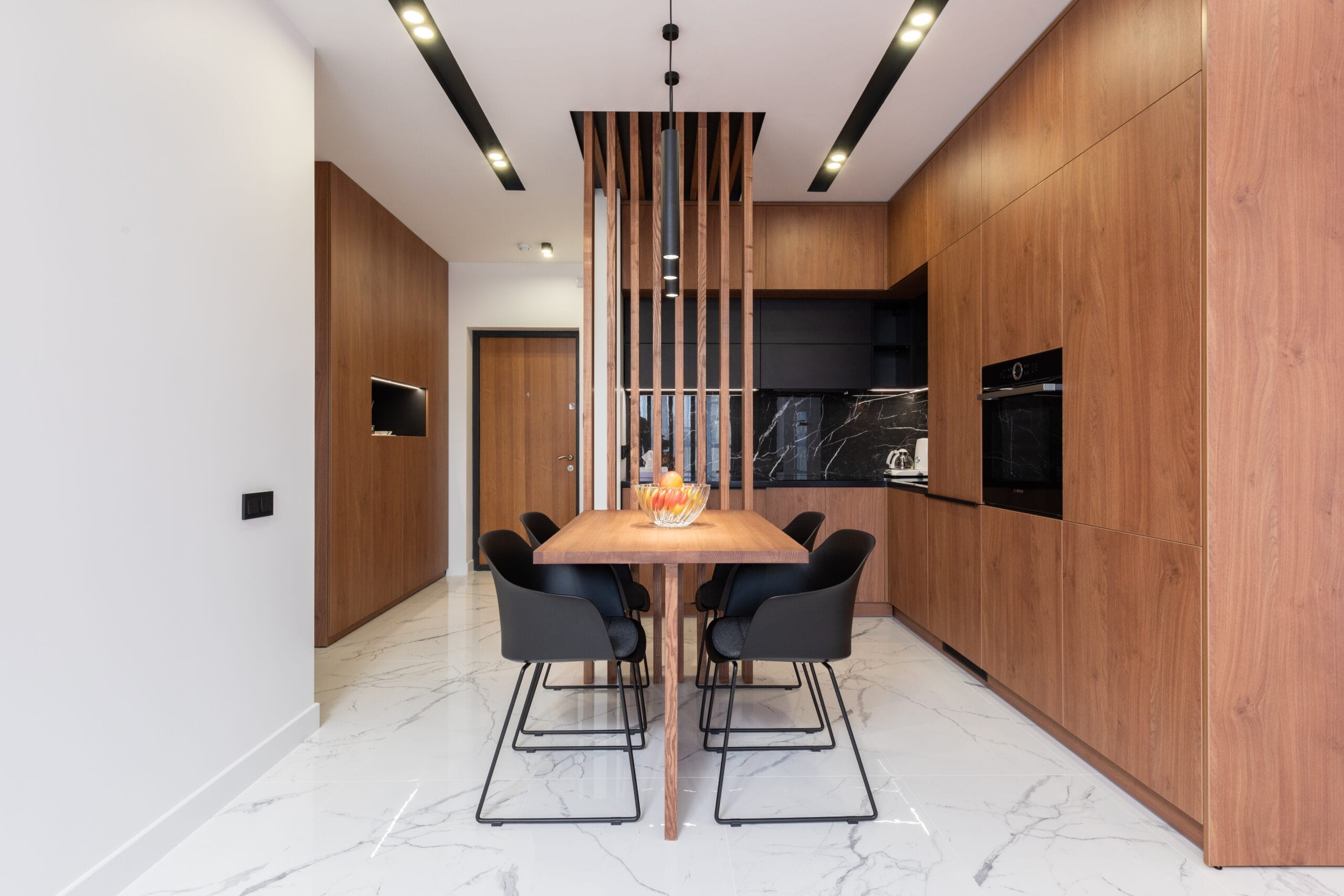 modern dining room with wooden flooring and light colored walls
